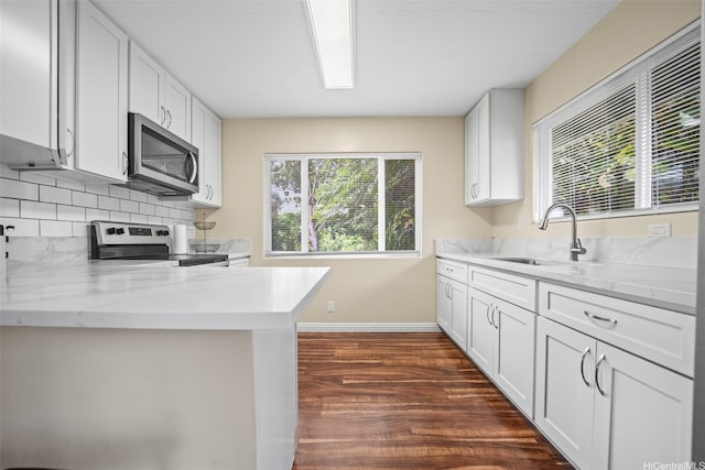 53-388 Kamehameha Hwy, Hauula, HI 96717 - kitchen with appliances with stainless steel finishes, a sink, dark wood finished floors, baseboards, and tasteful backsplash