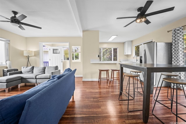 53-388 Kamehameha Hwy, Hauula, HI 96717 - living area featuring a ceiling fan, dark wood-style floors, and baseboards
