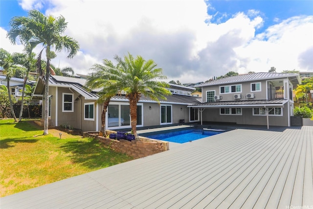 98-1027 Palula Way, Aiea, HI 96701 - back of property with a standing seam roof, a metal roof, a yard, an outdoor pool, and a wooden deck
