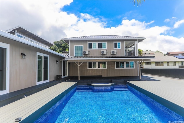 98-1027 Palula Way, Aiea, HI 96701 - back of house featuring a hot tub, a standing seam roof, a metal roof, and an outdoor pool
