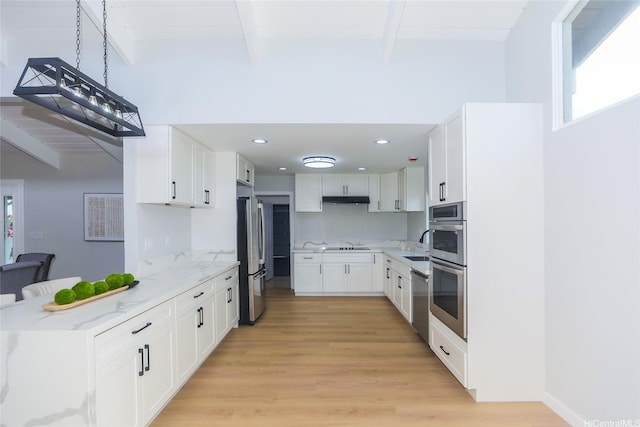 98-1027 Palula Way, Aiea, HI 96701 - kitchen featuring appliances with stainless steel finishes, beam ceiling, light stone counters, under cabinet range hood, and light wood finished floors