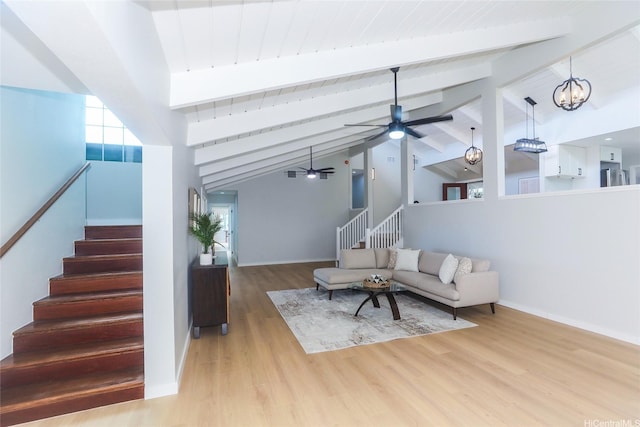 98-1027 Palula Way, Aiea, HI 96701 - living area featuring stairs, a ceiling fan, wood finished floors, high vaulted ceiling, and a chandelier