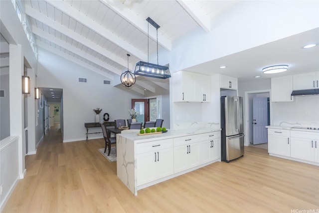 98-1027 Palula Way, Aiea, HI 96701 - kitchen with freestanding refrigerator, under cabinet range hood, white cabinets, a peninsula, and a wood ceiling with exposed beams