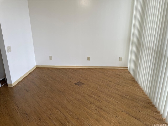 930 Kaheka St Unit 1703, Honolulu, HI 96814 - empty room with wood finished floors and baseboards