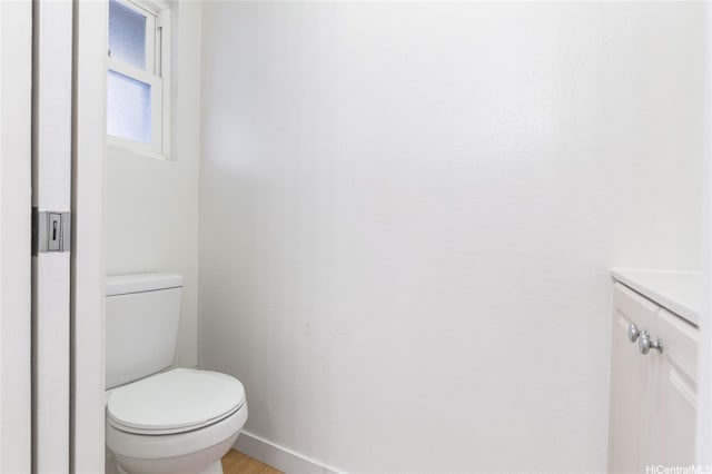 87-1958 Pakeke St Unit C, Waianae, HI 96792 - bathroom featuring toilet, vanity, baseboards, and wood finished floors
