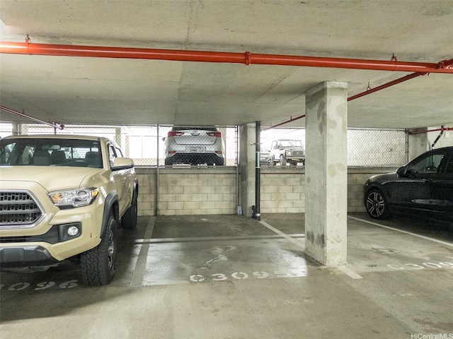 1009 Kapiolani Blvd Unit 2404, Honolulu, HI 96814 - parking deck featuring concrete block wall