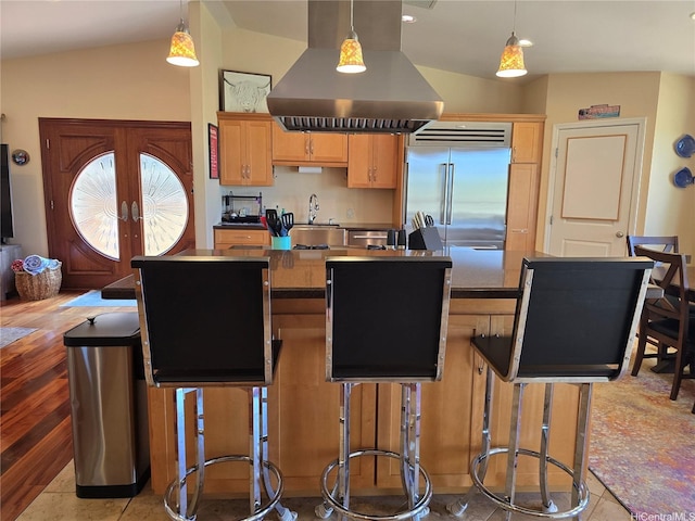 92-882 Wainohia St, Kapolei, HI 96707 - kitchen with island range hood, built in refrigerator, a center island, dark countertops, and lofted ceiling