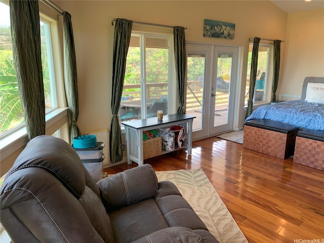 92-882 Wainohia St, Kapolei, HI 96707 - bedroom featuring french doors, access to exterior, multiple windows, and wood finished floors