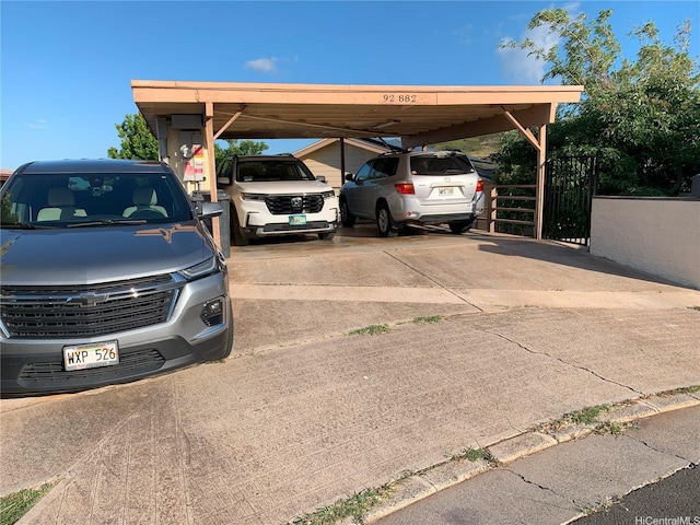 92-882 Wainohia St, Kapolei, HI 96707 - view of parking / parking lot featuring driveway and a carport