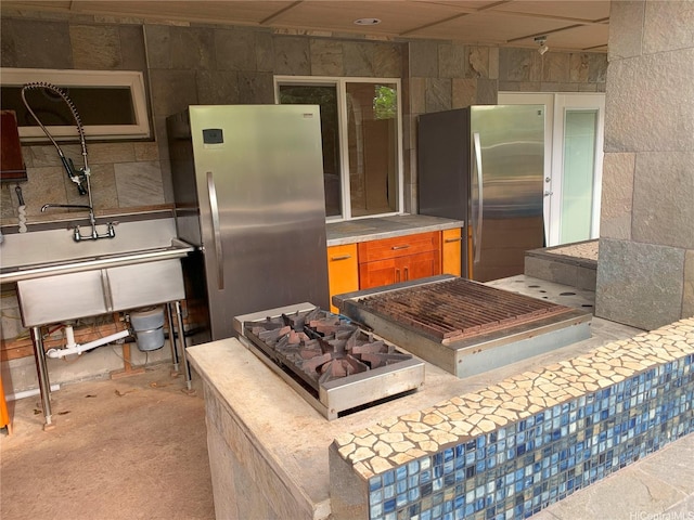 92-882 Wainohia St, Kapolei, HI 96707 - kitchen featuring freestanding refrigerator, brown cabinets, white microwave, and light countertops