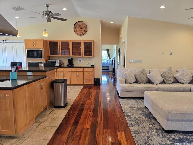 92-882 Wainohia St, Kapolei, HI 96707 - kitchen with black microwave, a ceiling fan, dark countertops, open floor plan, and recessed lighting
