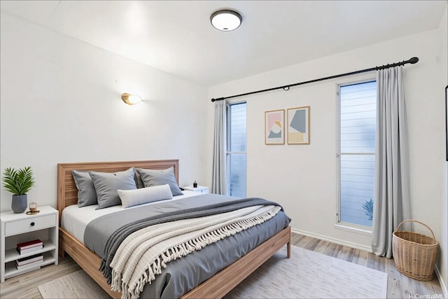 3071 Pualei Cir Unit 201, Honolulu, HI 96815 - bedroom with light wood-type flooring and baseboards