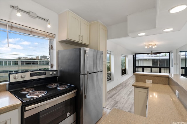 3071 Pualei Cir Unit 201, Honolulu, HI 96815 - kitchen with stainless steel appliances, open floor plan, white cabinetry, light wood-style flooring, and recessed lighting
