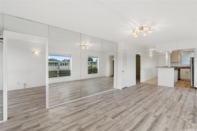 3071 Pualei Cir Unit 201, Honolulu, HI 96815 - unfurnished living room featuring light wood-style floors