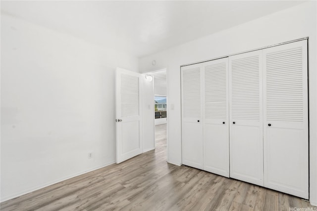 3071 Pualei Cir Unit 201, Honolulu, HI 96815 - unfurnished bedroom featuring light wood finished floors and a closet