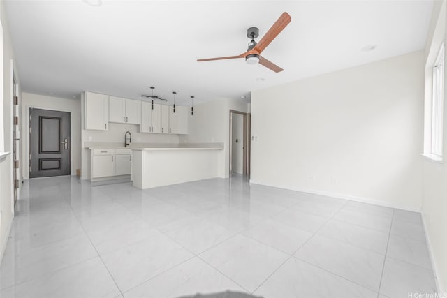 87-1474 Akowai Rd, Waianae, HI 96792 - unfurnished living room featuring a ceiling fan and light tile patterned floors