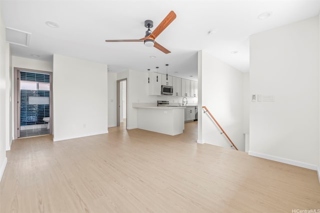 87-1474 Akowai Rd, Waianae, HI 96792 - unfurnished living room featuring light wood-type flooring and a ceiling fan