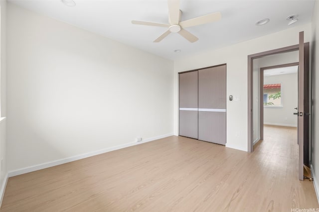 87-1474 Akowai Rd, Waianae, HI 96792 - unfurnished bedroom featuring light wood finished floors, a closet, and a ceiling fan