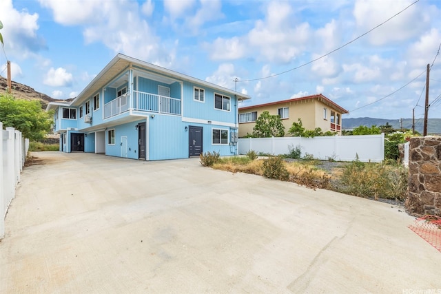 87-1474 Akowai Rd, Waianae, HI 96792 - view of front of home with concrete driveway and a balcony