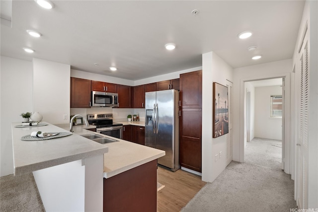 91-1081 Iwikuamoo St Unit 1202, Ewa Beach, HI 96706 - kitchen with stainless steel appliances, a peninsula, light countertops, and recessed lighting