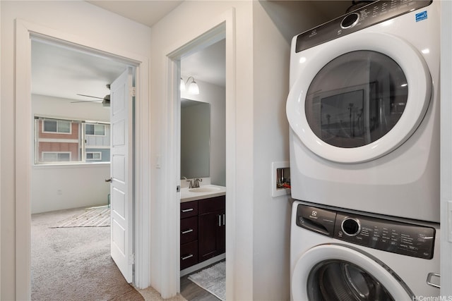 91-1081 Iwikuamoo St Unit 1202, Ewa Beach, HI 96706 - laundry area featuring stacked washer and clothes dryer, carpet flooring, and ceiling fan