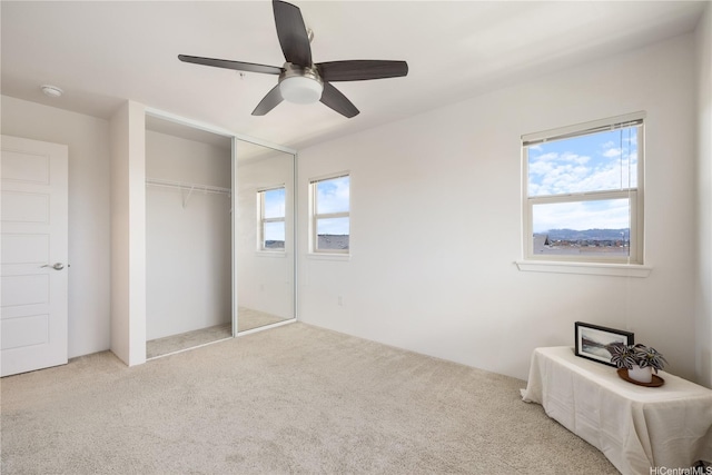 91-1081 Iwikuamoo St Unit 1202, Ewa Beach, HI 96706 - unfurnished bedroom featuring carpet, a ceiling fan, and a closet