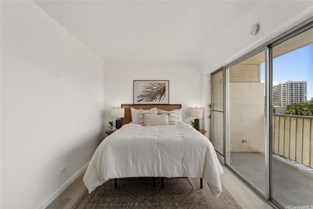 1620 Keeaumoku St Unit 506, Honolulu, HI 96822 - bedroom with light wood-style flooring and baseboards