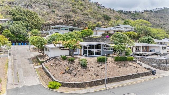 210 Hao St, Honolulu, HI 96821 - view of front of property featuring a sunroom and a mountain view