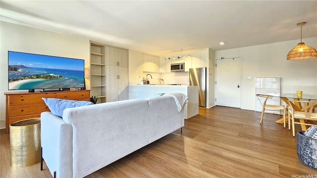 1910 Ala Moana Blvd Unit 32E, Honolulu, HI 96815 - living area featuring light wood-style flooring