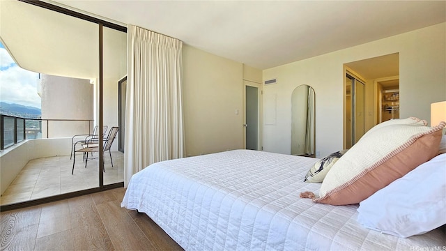 1910 Ala Moana Blvd Unit 32E, Honolulu, HI 96815 - bedroom with wood finished floors and access to exterior