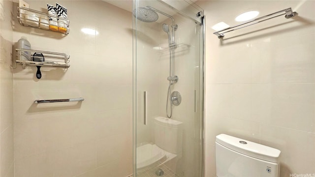 1910 Ala Moana Blvd Unit 32E, Honolulu, HI 96815 - bathroom featuring a stall shower and tile walls