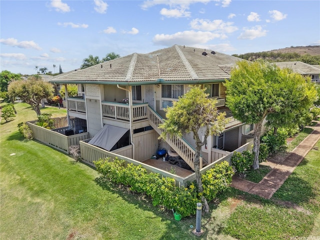 91-1077 Oaniani St Unit 10E, Kapolei, HI 96707 - back of property with a tile roof, a yard, and stairway