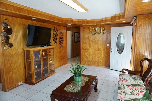 94-350 Kipou Pl, Waipahu, HI 96797 - entrance foyer featuring light tile patterned flooring, wood walls, and a textured ceiling