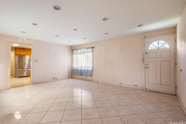 1425 Monte Cooke Pl, Honolulu, HI 96817 - entryway featuring healthy amount of natural light, light tile patterned flooring, and wooden walls
