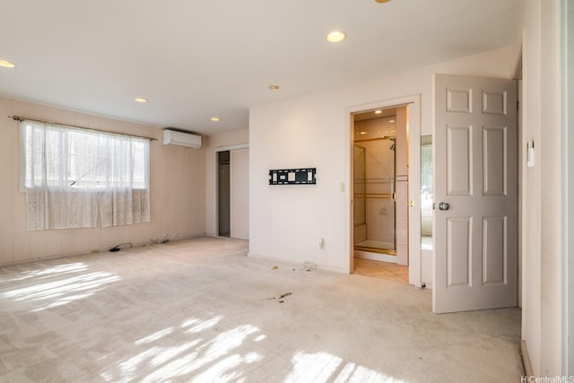 1425 Monte Cooke Pl, Honolulu, HI 96817 - unfurnished bedroom featuring light carpet, a wall mounted air conditioner, recessed lighting, a closet, and ensuite bath