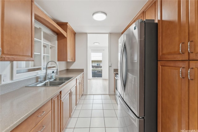 92-721 Anipeahi St, Kapolei, HI 96707 - kitchen with freestanding refrigerator, light tile patterned floors, light countertops, and brown cabinets