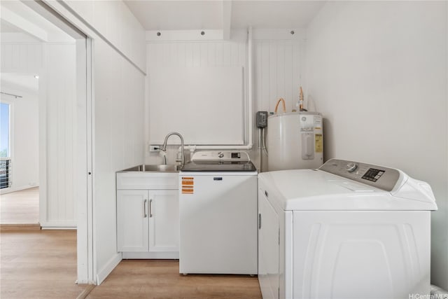 92-721 Anipeahi St, Kapolei, HI 96707 - laundry room with water heater, washing machine and clothes dryer, cabinet space, and light wood-type flooring