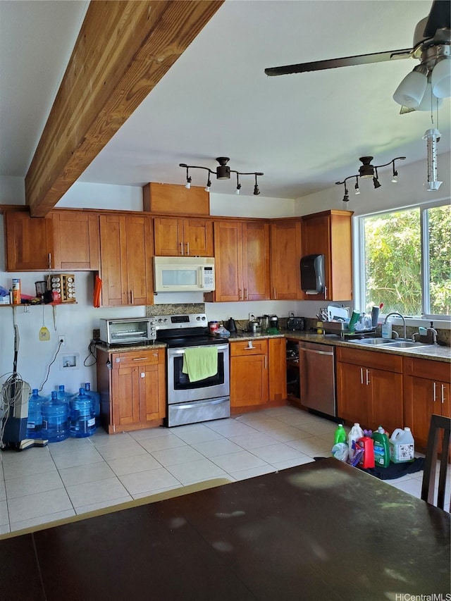 14-808 Crystal Cir, Pahoa, HI 96778 - kitchen featuring appliances with stainless steel finishes, a sink, brown cabinetry, and track lighting