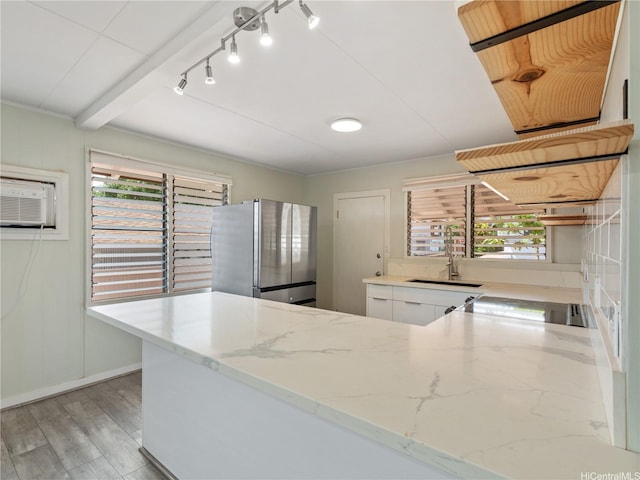 3622 Maunalei Ave, Honolulu, HI 96816 - kitchen featuring freestanding refrigerator, light wood finished floors, light stone counters, a sink, and white cabinets