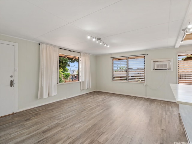 3622 Maunalei Ave, Honolulu, HI 96816 - unfurnished living room featuring healthy amount of natural light, wood finished floors, and baseboards