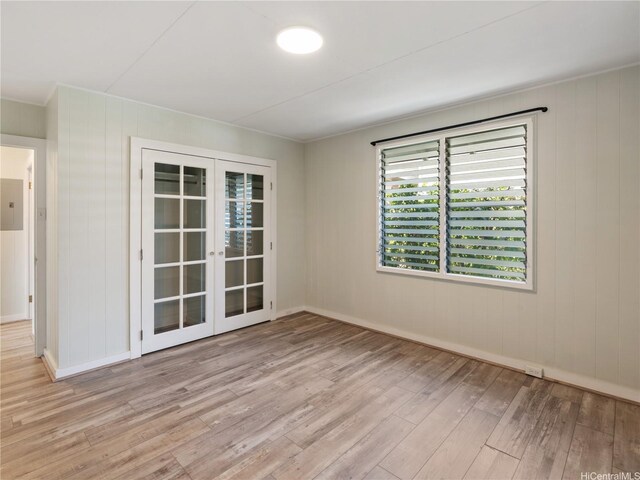 3622 Maunalei Ave, Honolulu, HI 96816 - unfurnished room featuring french doors, hardwood / wood-style flooring, electric panel, and baseboards