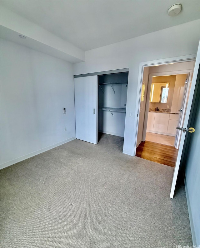 987 Queen St Unit 2403, Honolulu, HI 96814 - unfurnished bedroom featuring carpet floors and a closet
