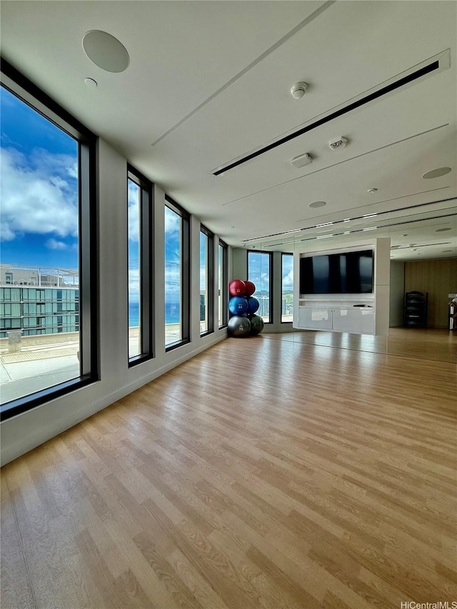 987 Queen St Unit 2403, Honolulu, HI 96814 - unfurnished living room with wood finished floors