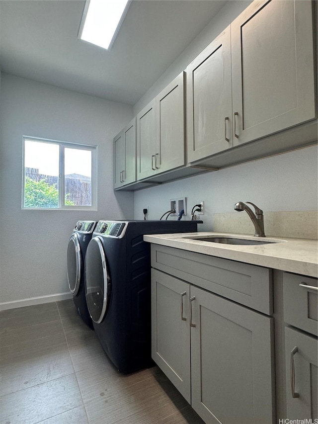 2318 Waiomao Rd Unit 4, Honolulu, HI 96816 - washroom with cabinet space, separate washer and dryer, baseboards, and wood finished floors