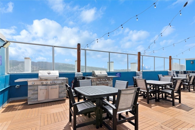 2427 Kuhio Ave Unit 2103, Honolulu, HI 96815 - view of patio / terrace featuring outdoor dining area, exterior kitchen, and a wooden deck