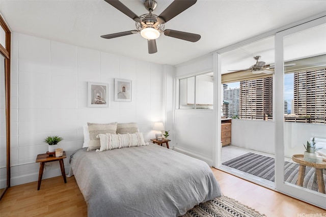 425 Ena Rd Unit Ph3B, Honolulu, HI 96815 - bedroom with light wood-style flooring and a ceiling fan