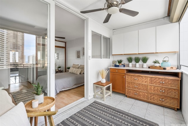 425 Ena Rd Unit Ph3B, Honolulu, HI 96815 - kitchen featuring a ceiling fan, light countertops, white cabinetry, and brown cabinetry