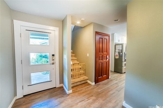 87-107 Kulaaupuni St Unit 2, Waianae, HI 96792 - foyer featuring stairs and light wood-style flooring