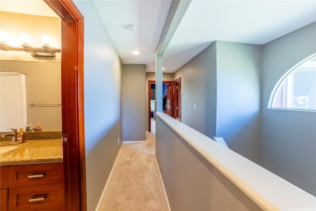 87-107 Kulaaupuni St Unit 2, Waianae, HI 96792 - hallway featuring light carpet, an upstairs landing, and recessed lighting