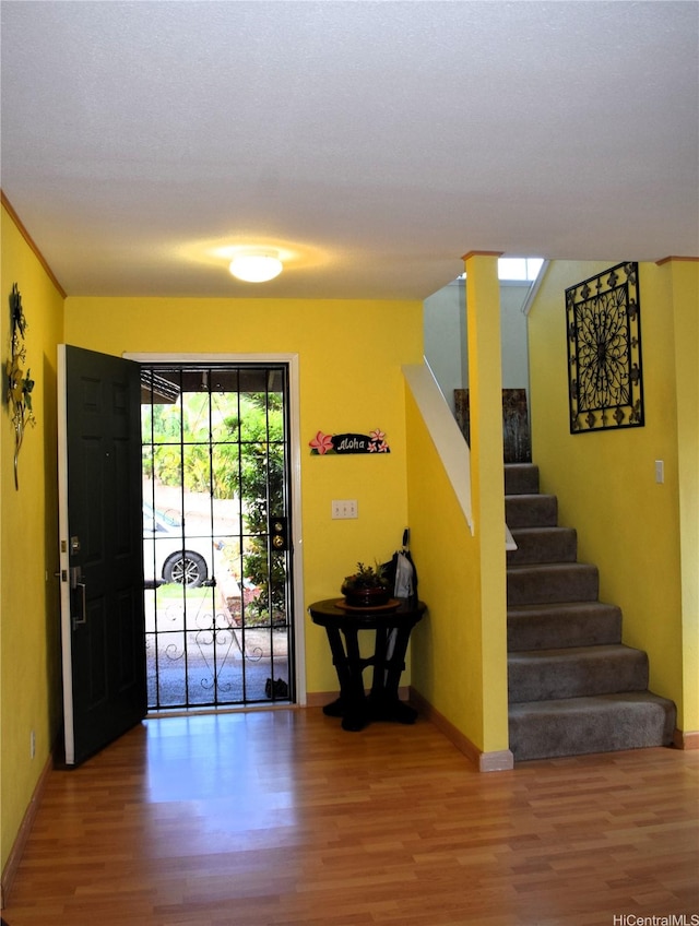94-1059 Pouhana Way Unit 3, Waipahu, HI 96797 - entrance foyer with wood finished floors and stairway